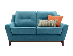 blue two-seater sofa with tufted back cushions and tapered wooden legs.