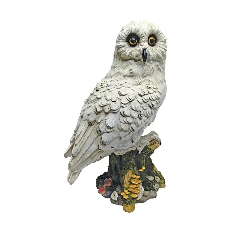 Mystical White Owl Statue by Design Toscano. It is a decorative sculpture of a snowy owl.