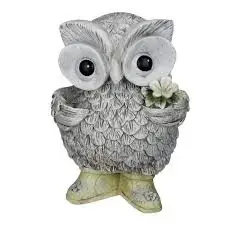 Mystical White Owl Statue by Design Toscano. It is a decorative sculpture of a snowy owl.